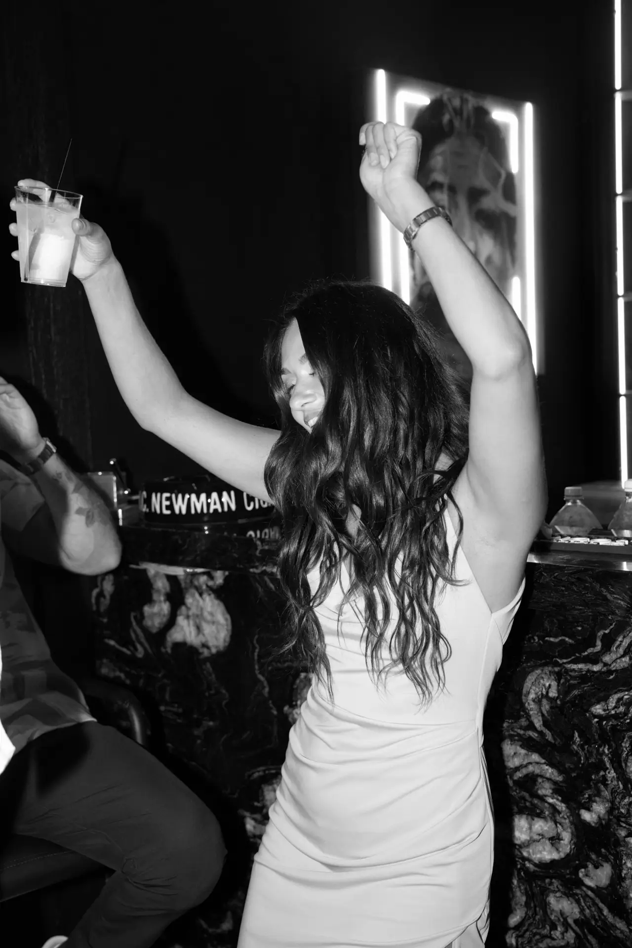 Black and white candid photograph focused on genuine emotion and storytelling